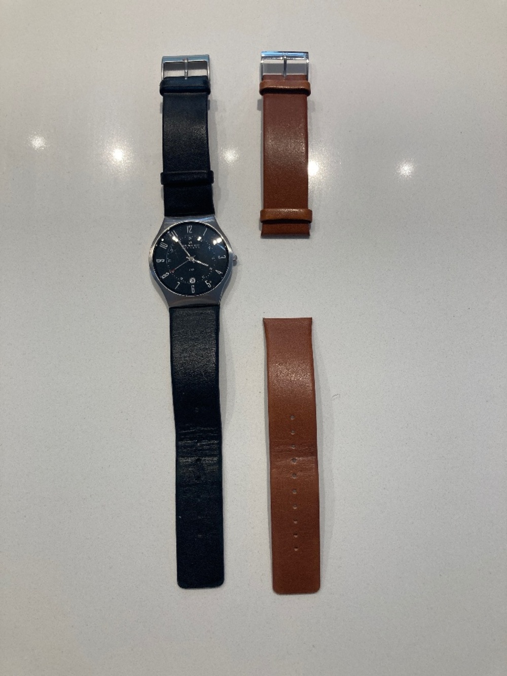 Men’s Skagen watch face with two straps